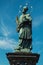 The statue of John of Nepomuk on Charles Bridge in Prague