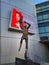 A statue of Kareem Abdul-Jabbar shooting a basketball with his sky hook shot wearing a Lakers uniform