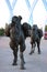 Statue of a kazakh man and camels in the Jetisy Park in Astana.
