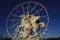 Statue of King of Fame riding Pegasus on the Place de la Concorde with ferris wheel at background, Paris, France