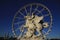 Statue of King of Fame riding Pegasus on the Place de la Concorde with ferris wheel at background, Paris, France