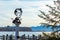 Statue of King Ludwig II in paper cutout style portrait displays at a boat dock in Herrenchiemsee, Germany