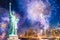 The Statue of Liberty with blurred background of cityscape with beautiful fireworks at night, Manhattan, New York City