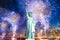 The Statue of Liberty with blurred background of cityscape with beautiful fireworks at night, Manhattan, New York City