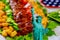 Statue of Liberty and blurry party table with meat and vegetable not in focuse