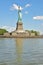 Statue of Liberty on Liberty Island with full reflection