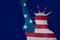 Statue of liberty in New York silhouette on usa star and stripes flag