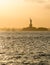 Statue of Liberty before sunset in hazy New York Harbor