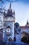 Statue of a lion at entrance and stone gate at entrance to to Vajdahunyad Castle in City Park of Budapest, Hungary.