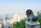 Statue of a lion on the Victoria Peak and view of Hong Kong city