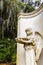 Statue of Little Angel With Bowl at Bonaventure Cemetery