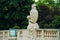 Statue of little boy with a big vase