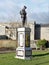 Statue of a lone soldier on a plinth in The Memorial Gardens in Old Amersham, Buckinghamshire, UK