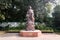 The statue of Mahatma Gandhi with children in bronze standing in the courtyard