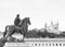 Statue of a man on horseback looking at the Cathedral of FourviÃ¨re in the city of Lyon