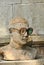 Statue of a man with plastic eyeglasses