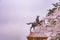 A statue of Masamune Date on horseback entering Sendai Castle in full bloom cherry blossom, Aobayama Park, Sendai, Miyagi, Japan