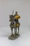 Statue of a medieval mounted knight in armour on White background