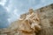 Statue of Menander at Acropolis on cloudy sky