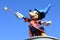 A statue of Mickey Mouse in Disneyland Paris in France on the blue sky background