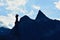 Statue and mountain peak in the evening at the Great St Bernard Pass