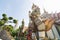 Statue of the mythical Guard at the entrance of Ordination hall at Wat Arun in Bangkok, Thailand