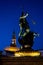 Statue of Neptun on Stary Rynek town square in Poznan, Poland, Europe at night