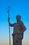 Statue of Neptune, God of the seas, on a blue sky background