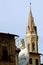 The statue of Neptune in Piazza della Signoria and the tower of Badia Fiorentina - Monastero in background in Florence.