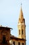 The statue of Neptune in Piazza della Signoria and the tower of Badia Fiorentina - Monastero in background in Florence.