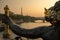 Statue of Nymphs with locks on Alexandre III bridge with Eiffel Tower in the background at sunset time in Paris