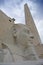 Statue and obelisk on blue sky