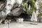 Statue of Our Lady of Immaculate Conception with a rosary in the Grotto of Massabielle in Lourdes