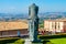 The statue of the penitent knight in the meadow in front of Saint Francis Basilica in Assisi, Umbria, Italy