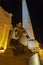 Statue of pharaoh head at an ancient egyptian temple in night