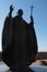 Statue of pope John Paul II with raised right hand and his cross in left hand, as installed on castle Nitra, Slovakia.