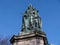 Statue of Queen Victoria in Lancaster England standing above politicians, artists and writers