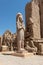 The statue of Ramses II with his daughter Merit-Amon in the temple of Amun-RA in Karnak, Luxor, Egypt