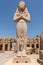 The statue of Ramses II with his daughter Merit-Amon in the temple of Amun-RA in Karnak, Luxor, Egypt