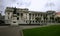 Statue of Richard John Seddon in front of old Edwardian parliament in grey stone with classic colonnade, Wellington, New Zealand