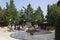 Statue of Risen Christ in Medjugorje, with pilgrims around