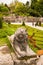 Statue of sad lion looking up. Mirabell garden, Salzburg, Austria