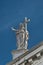 Statue of Saint with cross at San Stae catholic Church in Venice