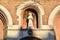 Statue of the Saint, in the foreground inside a frescoed niche, in the facade of the Basilica of Sant`Antonio in Padua.