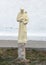 Statue Saint holding a cross with a dove on his shoulder at the Historic Saint Joseph Catholic Church in Fort Davis, Texas.