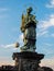 Statue of Saint John of Nepomuk holding Christ on cross, Charles Bridge