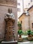 The statue of a scientist near Historical Museum of teaching Mauro Laeng in Rome, Italy