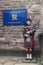 Statue of Scottish piper playing bagpipe at entrance of Regimental Museum inside Edinburgh Castle, Scotland, UK