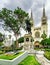 Statue of Simon Bolivar in Parque Seminario Seminar Park and the Metropolitan Cathedral of Guayaquil