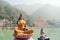 Statue of sitting goddess Parvati and Statue Shiva on the riverbank of Ganga in Rishikesh.